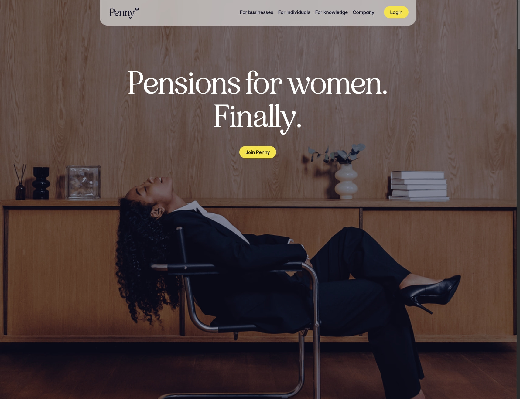 Full-bleed hero with woman reclining against wood paneling, white serif headline, and yellow pill button on darkened photograph captured website design