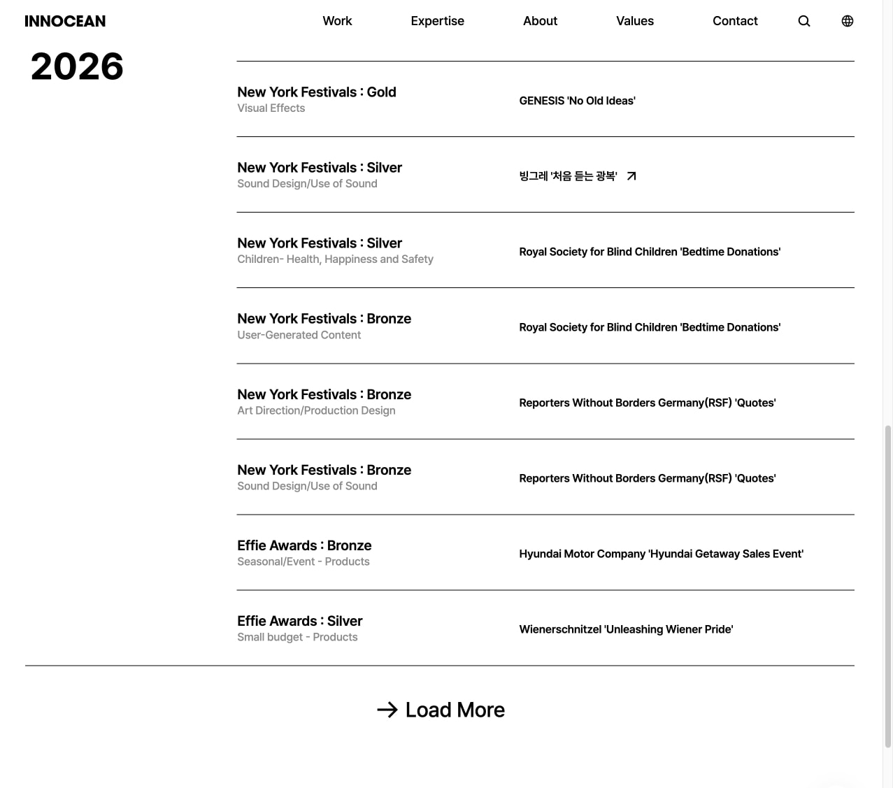 Awards list page showing 2026 entries with black horizontal rule separators and a Load More pill button on white canvas. captured website design