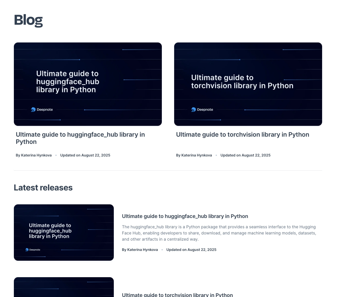 Blog index with large dark navy article thumbnails, white card titles, and a Latest releases section with horizontal list layout. captured website design