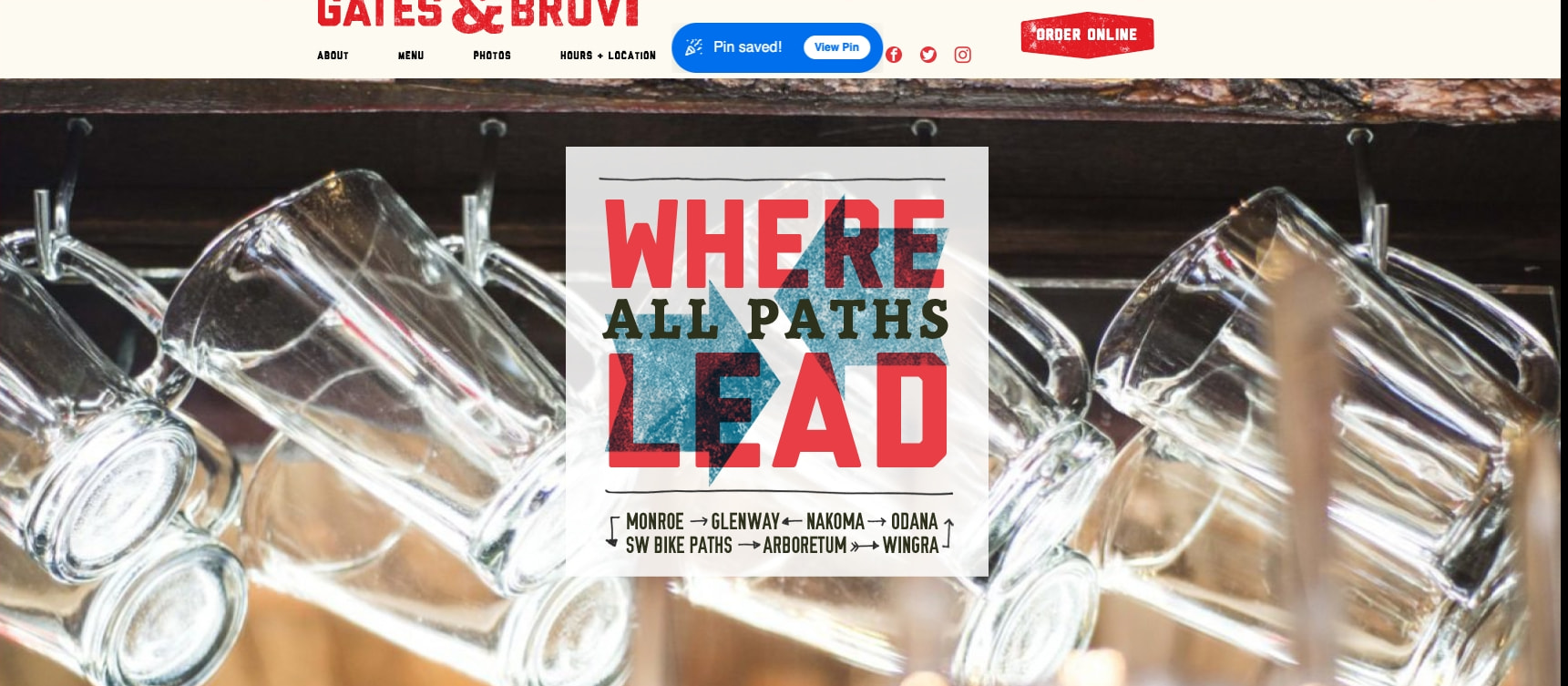Homepage hero close-up showing red and dark green layered typography on poster with directional arrows and neighborhood names captured website design