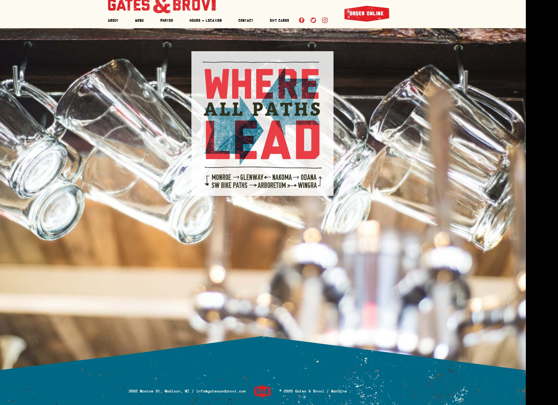 Homepage hero with hanging glass mugs, distressed typographic poster reading WHERE ALL PATHS LEAD, and teal footer with speckled texture captured website design
