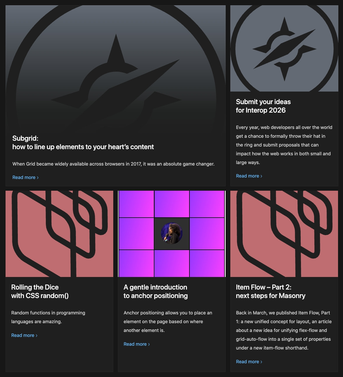 Homepage article grid with dark cards, colorful hero imagery in coral and purple tones, and blue read-more links captured website design