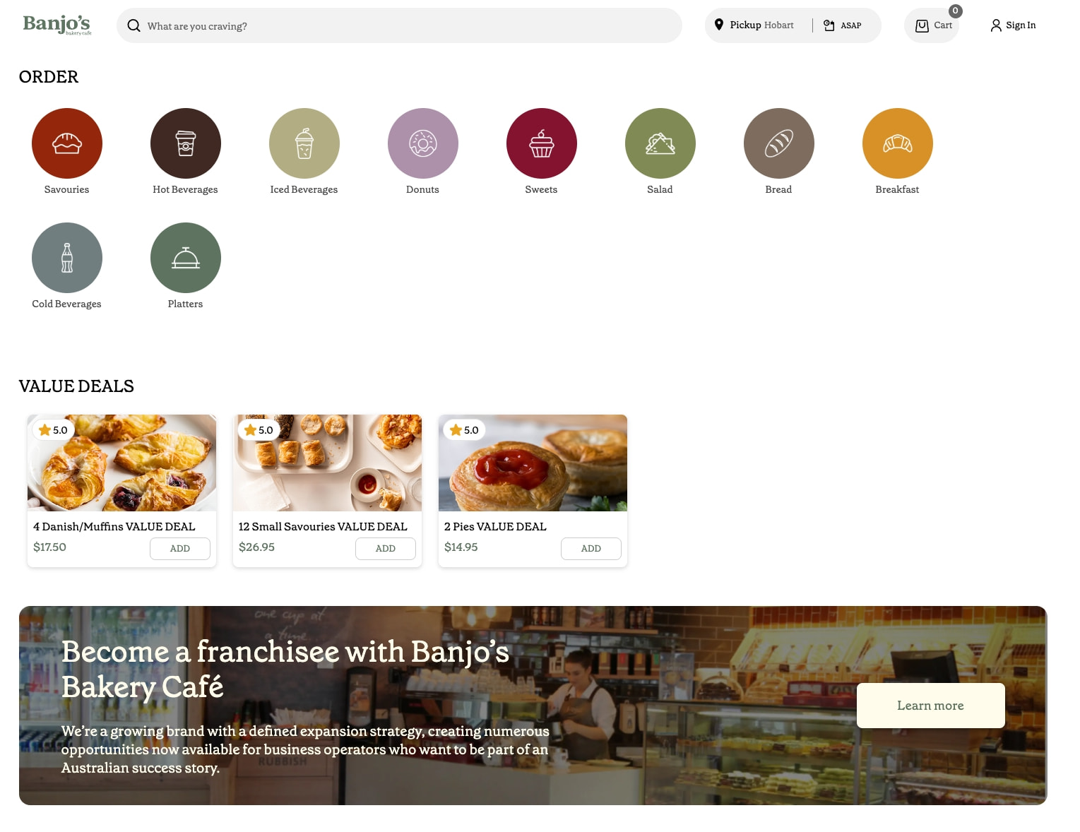 Homepage hero with colorful circular category icons in two rows, VALUE DEALS product cards with star ratings and ADD buttons, and a franchisee promotional banner with warm bakery captured website design