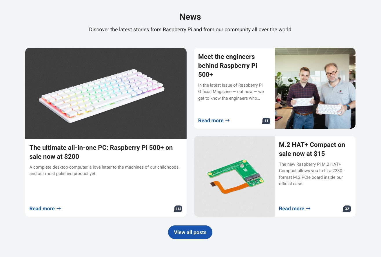 News section with card grid layout showing product announcements, article thumbnails, read-more links with arrow icons, and a blue pill-shaped view-all button captured website design