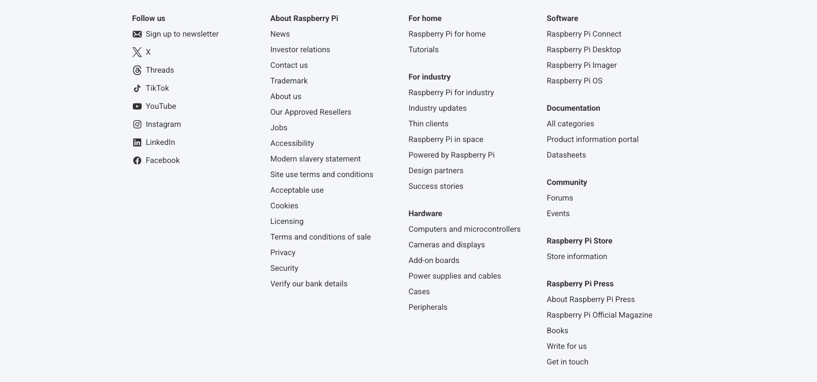 Multi-column footer with social links, categorized navigation sections, and dense text links on light grey background captured website design