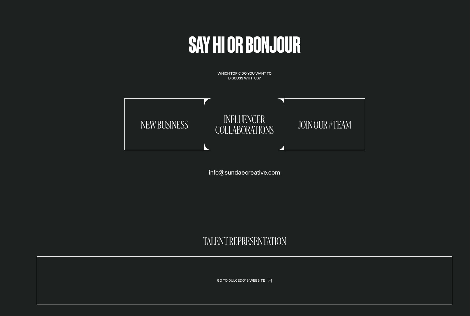 Contact section with large condensed headline, topic selection cards with corner notches, and outlined button captured website design