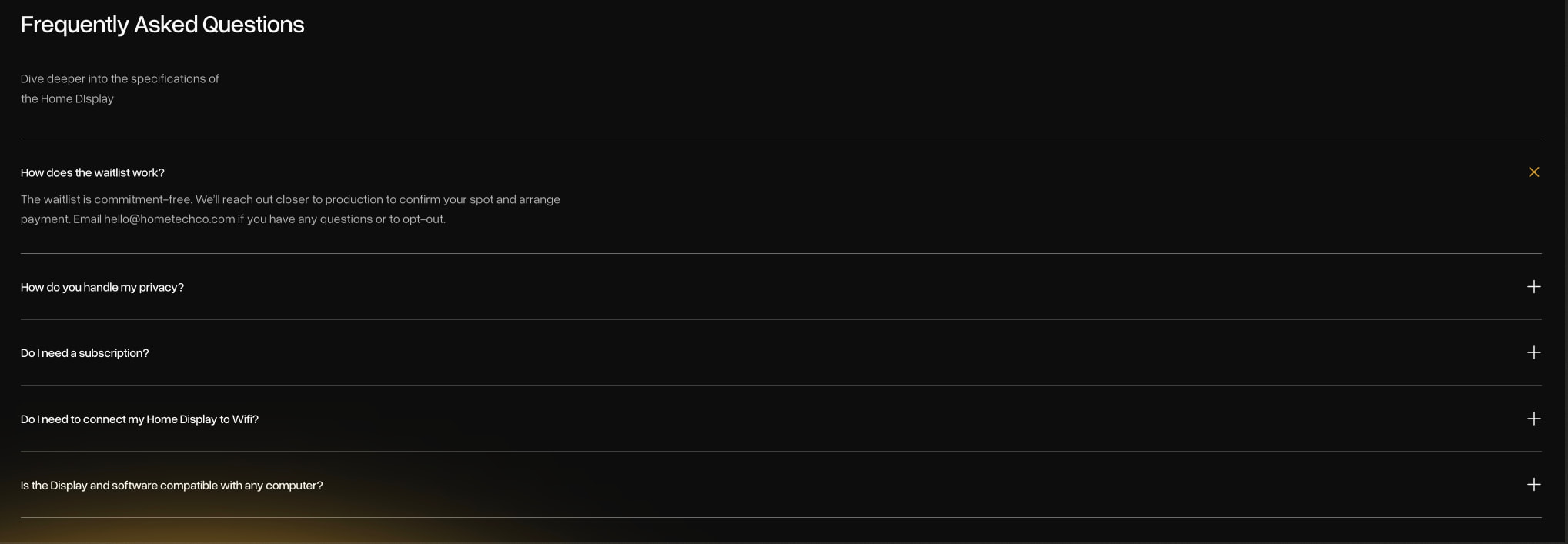 FAQ accordion with dark background, white question text, muted answer text, and amber open-state indicator icon captured website design