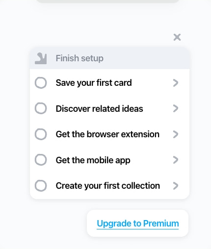 Finish setup checklist modal with circular checkboxes, chevron indicators, and blue underlined premium upgrade link captured website design