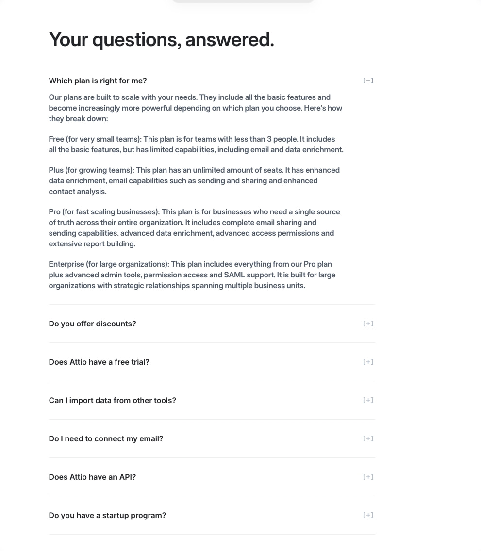 FAQ accordion section with large serif heading, collapsed items with plus icons, and an expanded answer with detailed plan descriptions. captured website design
