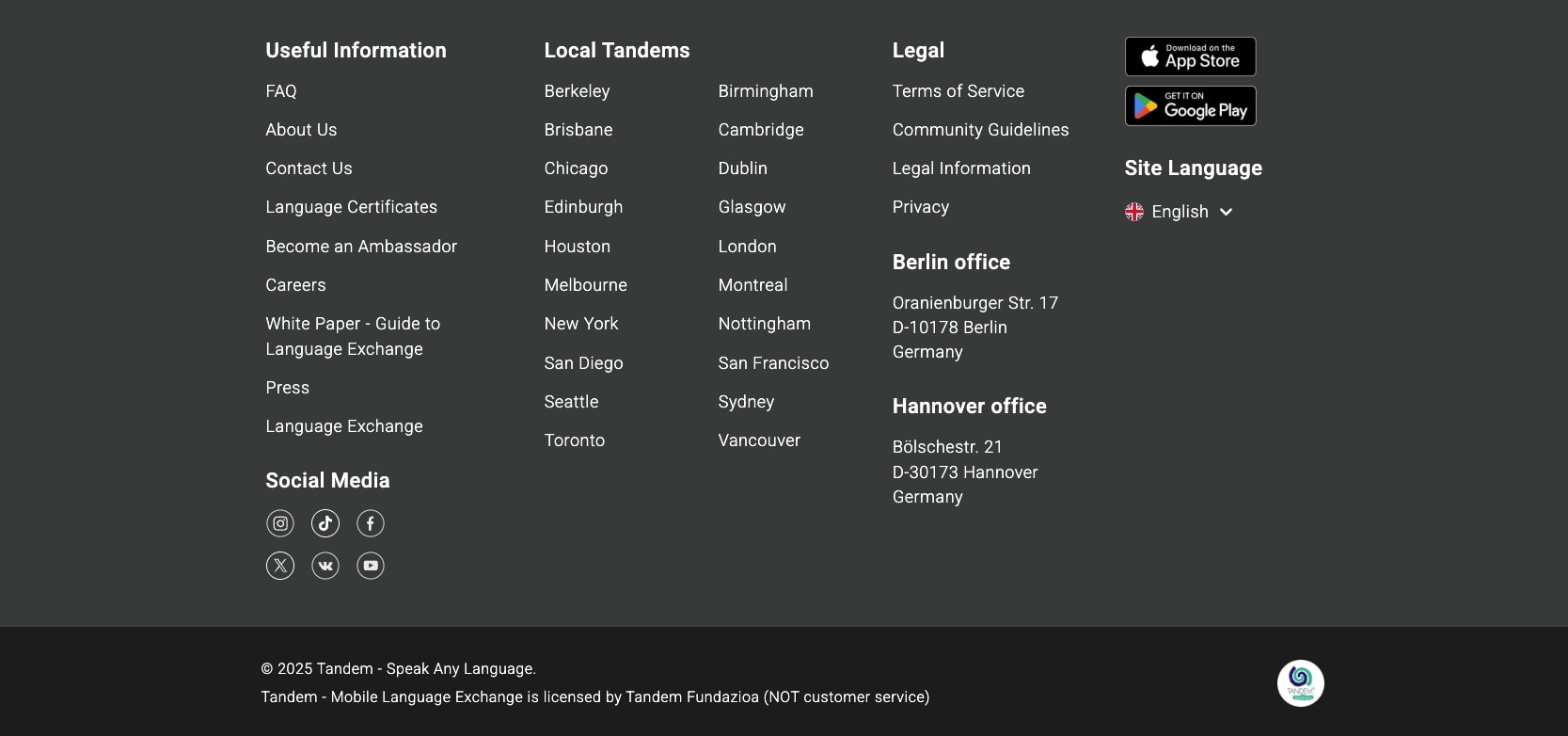 Dark charcoal footer with multi-column link lists, App Store badges, social media icons, and office addresses on a near-black background. captured website design